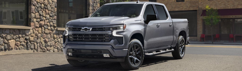 A white Colorado driving on a scenic road